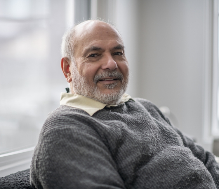 smiling old man in sweater