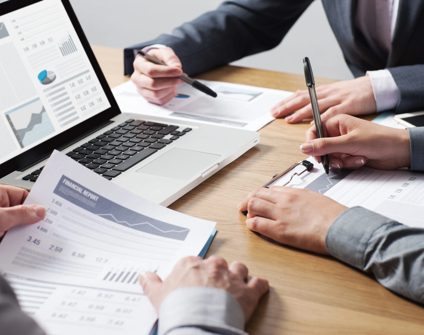 Trustee accountants looking at financial documents